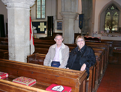 Ferrell and Elizabeth sitting in the pew of Jack and Warnie Lewis. Biblicalstudies.info.